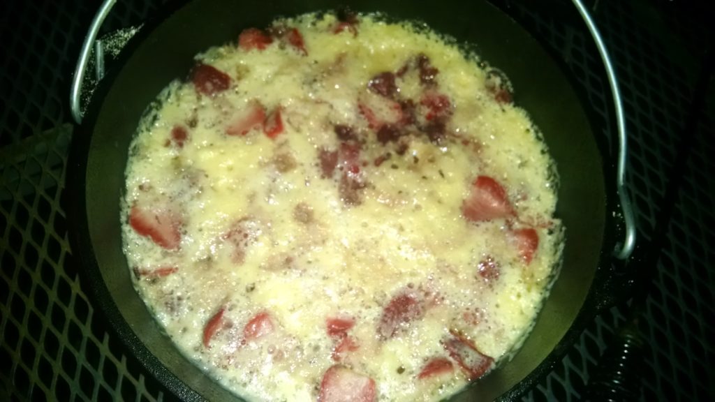 Strawberry cobbler via dutch oven tht is done